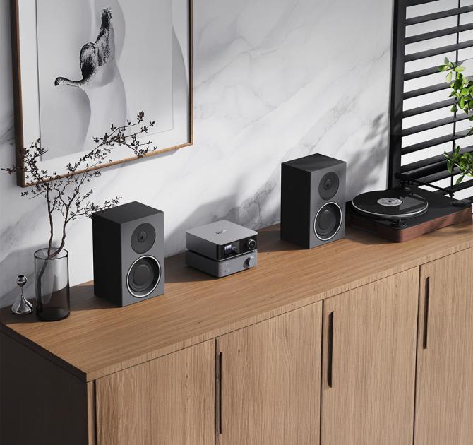 WiiM Vibelink Amp on a side unit with speakers either side
