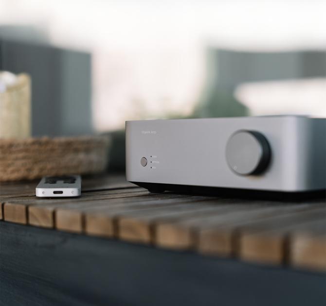 WiiM Vibelink Amp on a wooden shelf