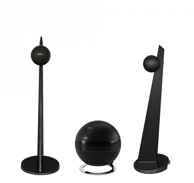 A pair of Cabasse iO3 Loudspeakers in black on a black stand with a Cabasse Pearl Sub in black between them