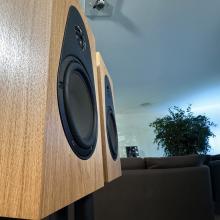 A pair of oak Linn 119 Loudspeakers in the ripcaster showroom