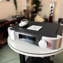 MOON 791 Network Player/Preamplifier front and top view with the remote control on the top of the unit