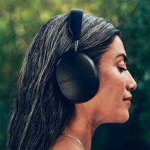 Sonos Ace Headphones in black on the head of a woman