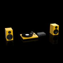 Two speakers and a turntable in yellow with a Project Maia S3