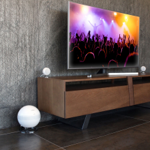 Cabasse Pearl Keshi Loudspeaker System in a modern living area with a flat screen television.
