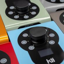 Six Kii Controllers in different colours placed in two rows of three.