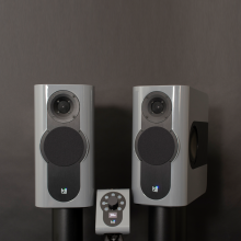 A pair of Kii Three Loudspeakers in Nardo Grey High Gloss with a matching Kii Controller