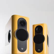 A pair of Kii Three Loudspeakers in matt yellow
