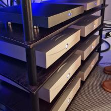 a rack of silver Klimax Solo 500 amplifiers