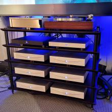 a rack of silver Klimax Solo 500 amplifiers