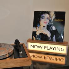 Now Playing wooden lightbox with a Madonna album in the groove at the top.  Beside an LP12