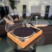Linn Majik MM LP12 Fluted turntable in oak in the ripcaster showroom with sofas and speakers in the background along with other HiFi equipment