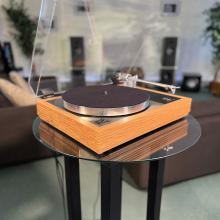 Linn Majik MM LP12 Fluted turntable in oak in the ripcaster showroom with sofas and speakers in the background along with other HiFi equipment