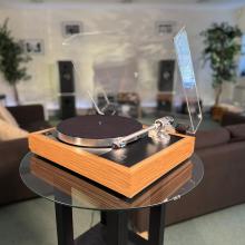 Linn Majik MM LP12 Fluted turntable in oak in the ripcaster showroom with sofas and speakers in the background along with other HiFi equipment