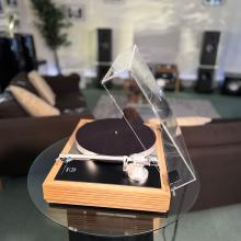 Linn Majik MM LP12 Fluted turntable in oak in the ripcaster showroom with sofas and speakers in the background along with other HiFi equipment
