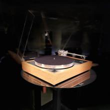 Linn Majik MM LP12 Fluted turntable in oak in the ripcaster showroom with sofas and speakers in the background along with other HiFi equipment