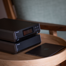 Melco N10/2 Digital Music Library in black.  One on top of the other on a table