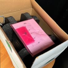 Naim HiCap Power Supply open box with instructions visible