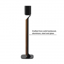 Flexson Premium Floor Stand One/Play1 Blk x1 - Black with speaker (not included) and the words "crafted from solid hardwood, aluminium, steel and glass".