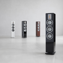 Audiovector QR5 in all colours.  Piano black in the foreground and three other QR5s in the background.