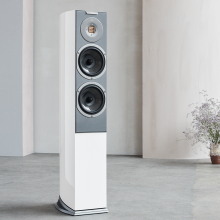Audiovector R3 Arreté with a vase of flowers in the background