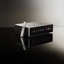 HiFi Rose RS151 Streamer/DAC in silver with the remote control resting against it