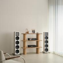 HiFi Rose RS151 Streamer/DAC on a HiFi rack with floorstanding speakers either side