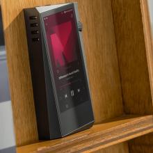 Astell & Kern A&norma SR35 Portable Music Player on a wooden shelf