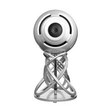 A large spherical speaker on an elaborate stand consisting of twisted legs