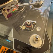The Vertere ISO Shelf viewed in one corner from above with a Vertere acrylic turntable on top of it.