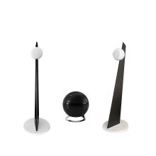 Cabasse iO3 speakers in white with black stands with a pearl sub
