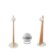 Cabasse iO3 speakers in white with oak stands with a white pearl sub